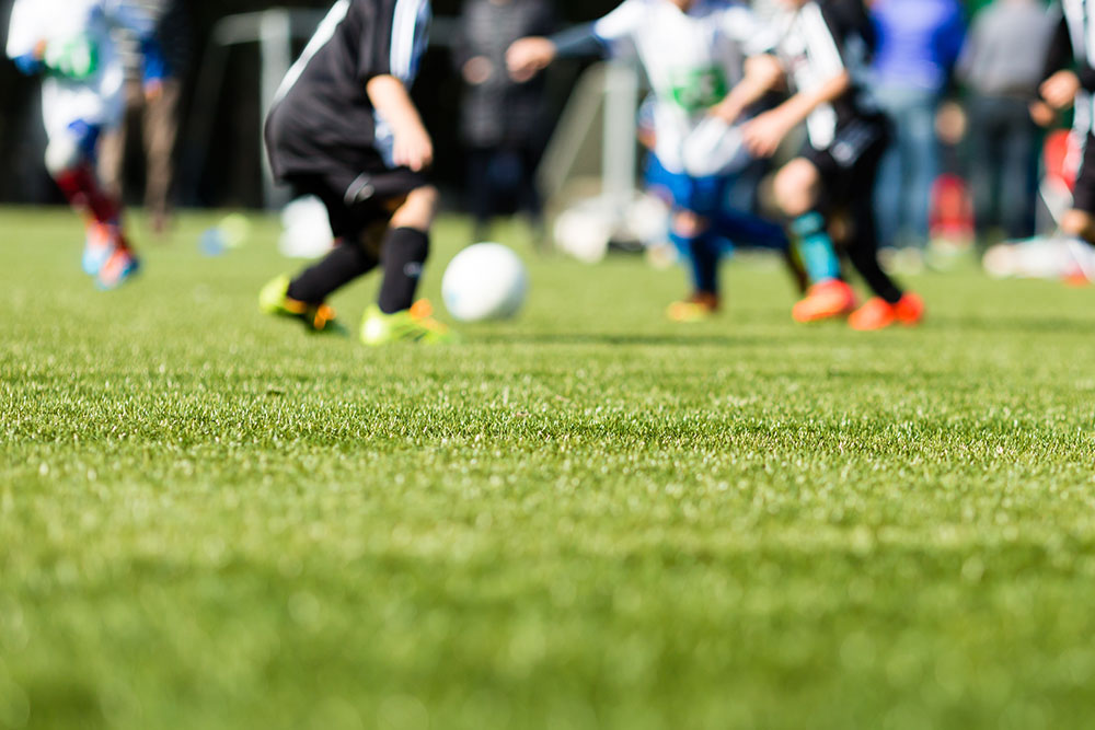 Soccer Players on Artificial Turf